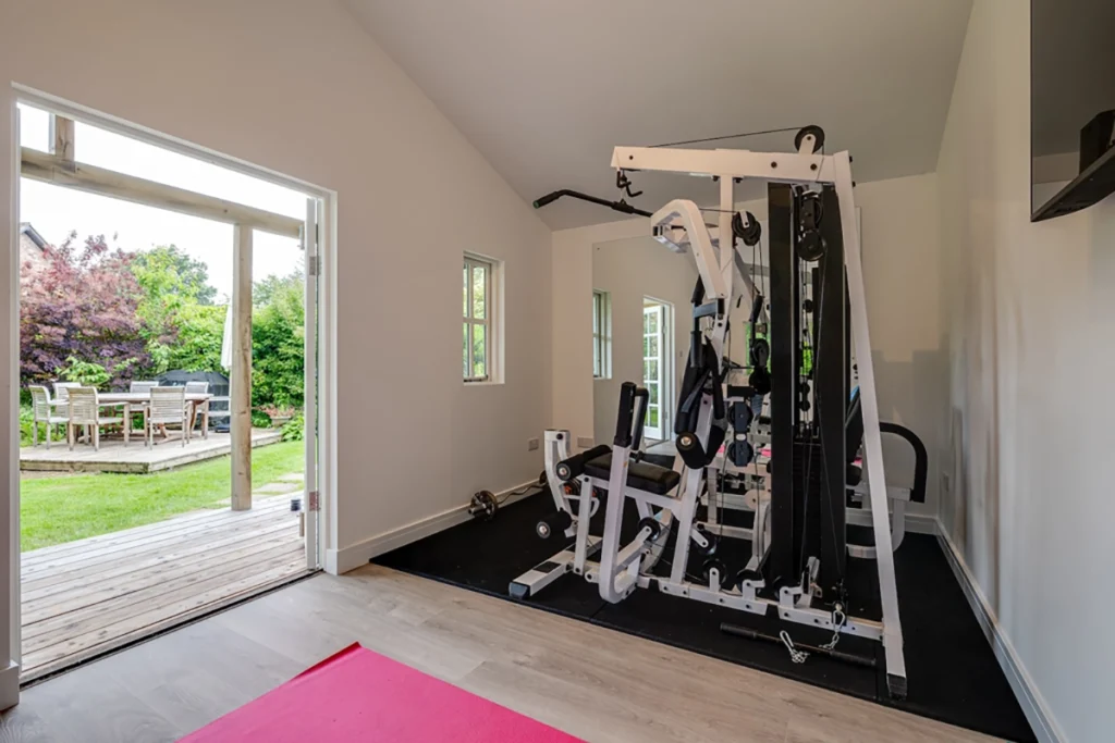 Garden home gym with weight machine and rubber gym flooring