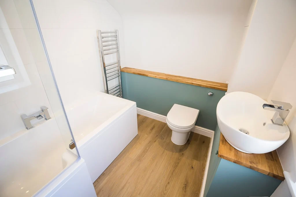 Contemporary shower room with green tiled feature wall
