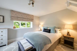 Renovated countryside cottage bedroom with soft neutral interior