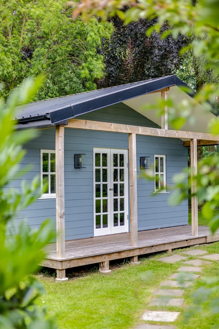 Bespoke timber frame home gym garden room with veranda and timber cladding