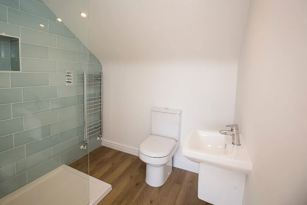 Modern bathroom renovation with bath and timber detailing